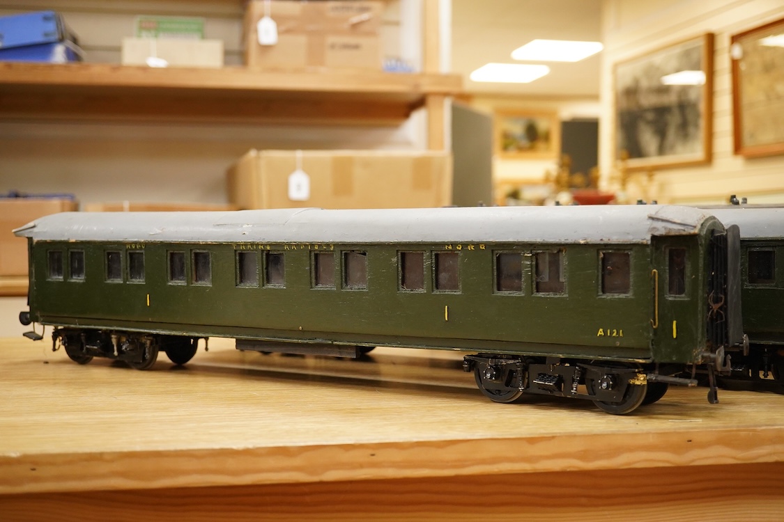 Four Gauge One Continental bogie coaches; two in very dark Green livery, and two ‘Trains Rapides Nord’ in dark green, including some scratch building and possible adaptation from kits